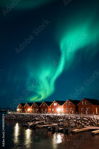 Northern Lights Over Red Cabins in Leknes, Lofoten