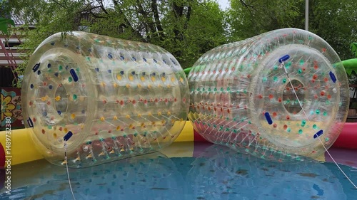 Water children's attraction in the park. Silicone transparent cylinder. Outdoor activities.