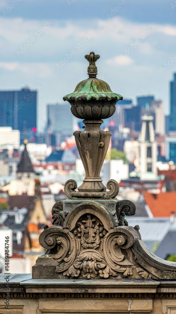 Obraz premium Detailed Architectural Ornamentation Against City Skyline Backdrop