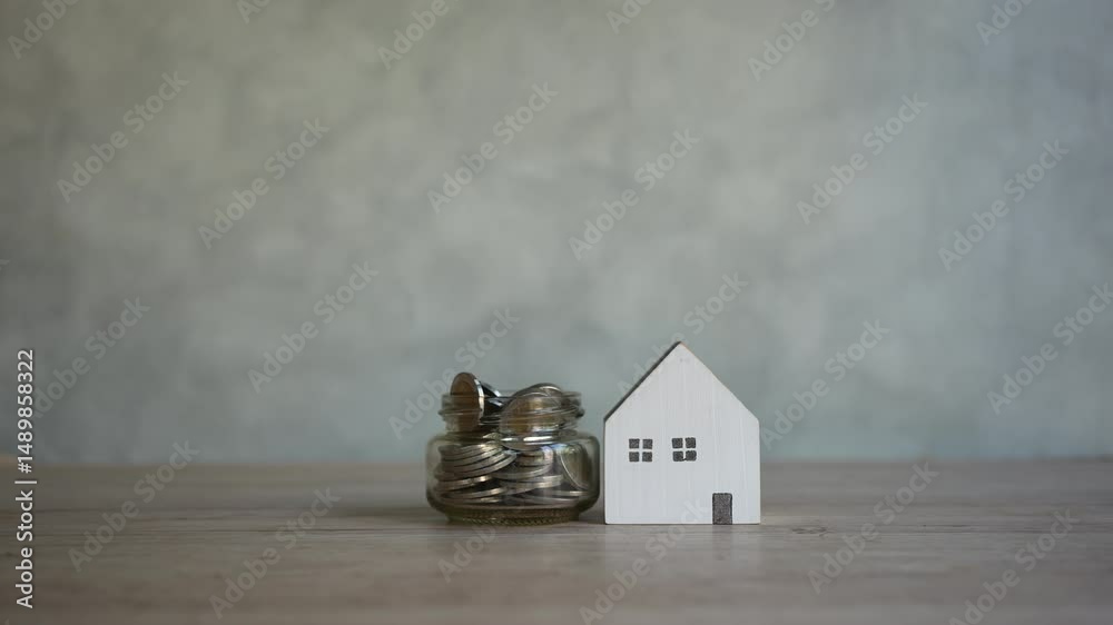 Save money, house and coins full in jar. Saving money to build a house, first home, home loan, home loan, cash and time, finance concept, income, salary, investment, financial loan, finance, cash flow