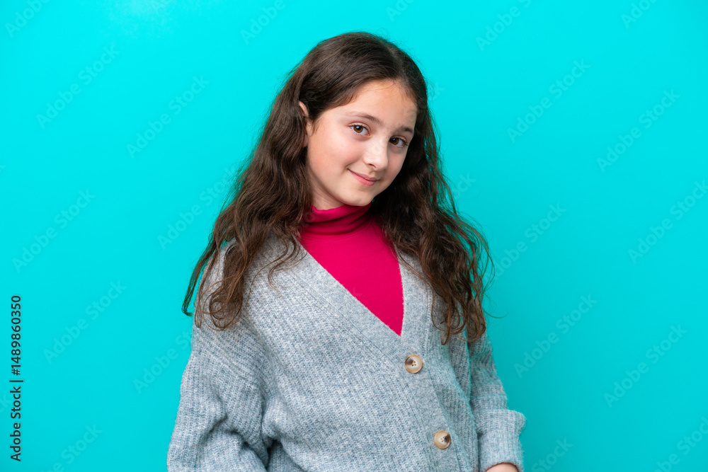 Fototapeta premium Little girl isolated on blue background laughing