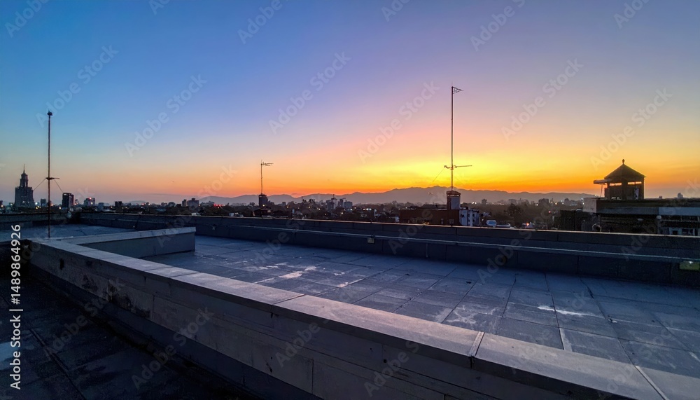 Naklejka premium Rooftop View at Sunrise, Noon, Sunset, and Midnight in Urban Landscape