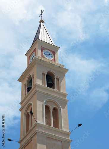 Italy and old traditional church, clock tower against sky. Village, town of Recco on seaside, Liguria. Tourism and sightseeing.