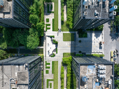 Fototapeta Naklejka Na Ścianę i Meble -  aerial view green city with tree around modern office building