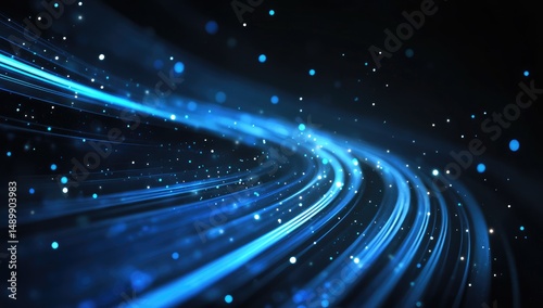 Abstract swirling blue light trails in a dark space.  Light streaks and particles create a dynamic, energetic effect