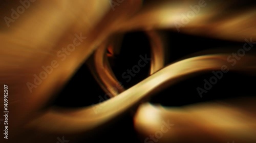 Abstract animation of golden wavy light ribbons or smoke. Flowing, elegant, and soft glowing lines on black