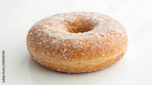 Delicious powdered donut on a clean white surface.