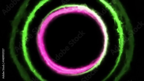 Abstract animation of glowing pink and lime green energy rings. Concentric circles with smoky texture pulsate on black background