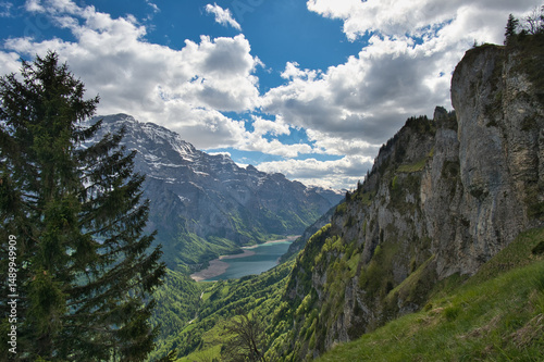Landscape of the Wiggis mountain with Glarus Alps and Klöntal lake with little water in Switzerland