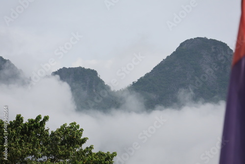 mountain landscape with fog and clouds in Vang Vieng Laos