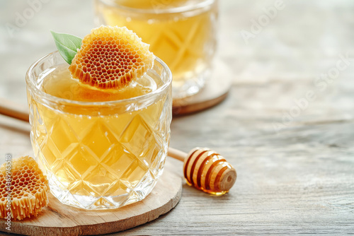 Golden Mead in Crystal Goblet with Honeycomb Garnish on Rustic Wood