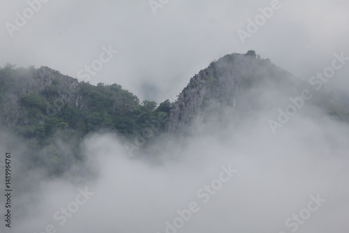 mountain landscape with fog and clouds in Vang Vieng Laos