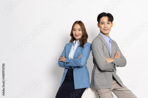 Foto Portrait of successful business asian couple in suit with arms crossed and smile
