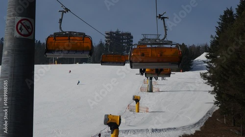 a gentle chairlift ride up snowy slopes
