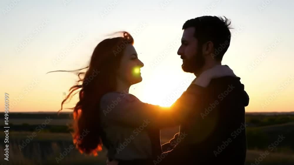 Silhouette couple embracing at sunset romantic love and affection Silhouette couple embracing at sunset romantic love and affection