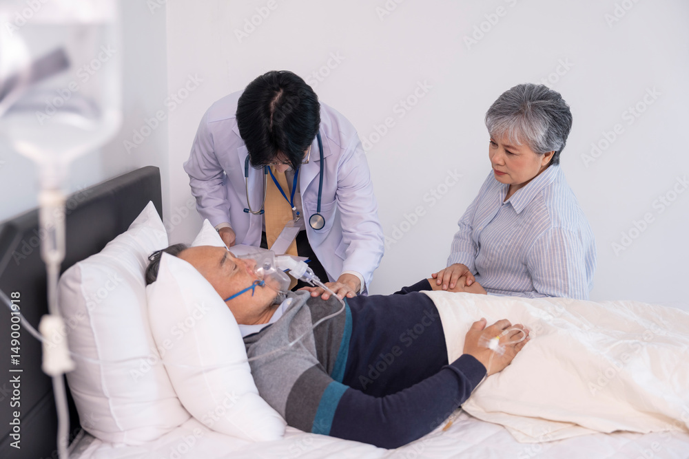 Obraz premium scene of a sad elderly woman holding hands a dying man on bed,on IV drip and oxygen,a doctor is physically examine,concept palliative care,end of life care