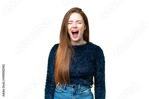 Young pretty woman over isolated chroma key background shouting to the front with mouth wide open