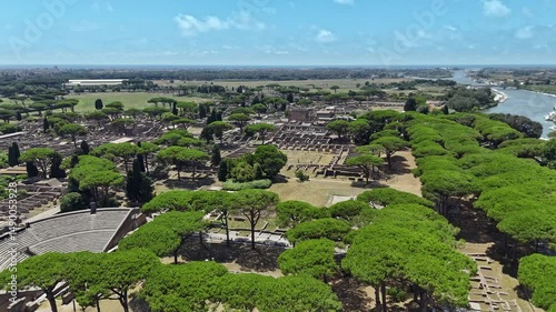 Aerial view on the Roman theatre of Ostia Antica, a large archaeological site, close to the modern town of Ostia. High quality footage in 4k format