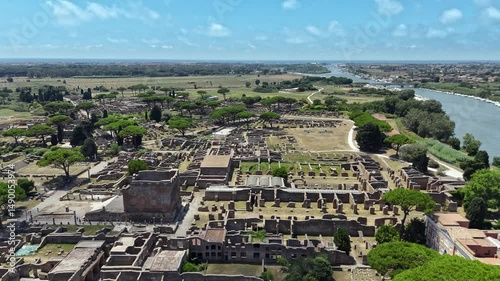 Aerial view on the Roman theatre of Ostia Antica, a large archaeological site, close to the modern town of Ostia. High quality footage in 4k format