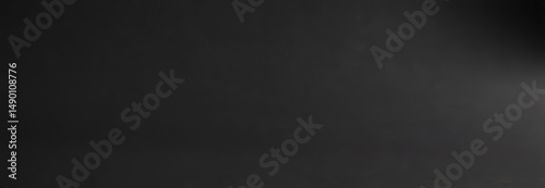 Deep black matte paper texture, elegant smooth surface, black background, contrast