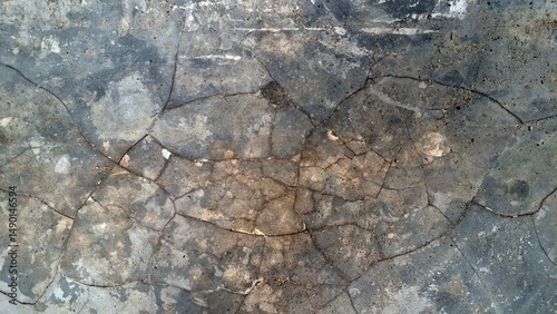 Old grunge concrete surface with weathered cement texture and rough stone patterns, ideal for industrial backgrounds	