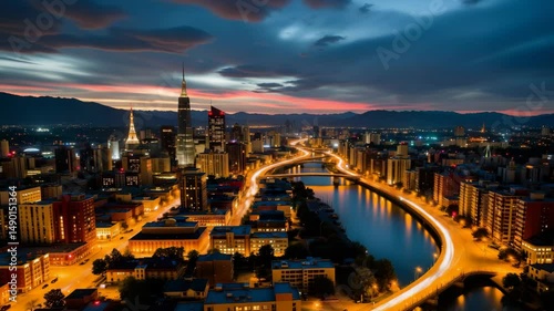 Majestic Sunset Over City Skyline with Modern Architecture and Reflections on River in Vibrant Colors