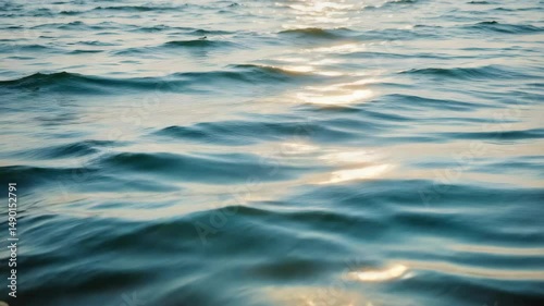 Serene Reflections on Calm Water Surface with Gentle Waves and Sunlight Dancing on Blue Liquid Canvas