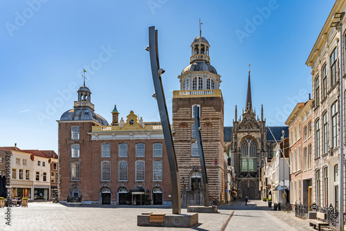 Bild auf Leinwand The town hall of Goes with the Church of Mary Magdalene in the background, province of Zeeland, Netherlands