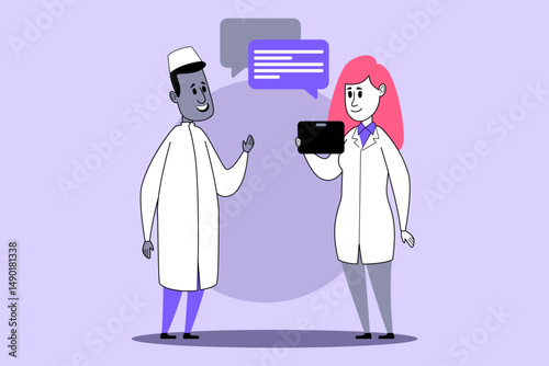 Two healthcare professionals interacting as one holding tablet, discussing patient information in modern setting. Technologys role in healthcare concept