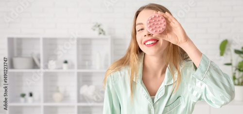 Young woman in pajamas with...