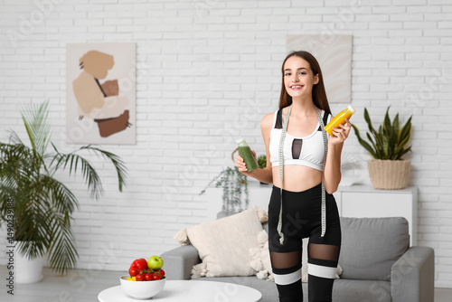 Sporty young woman with tap...