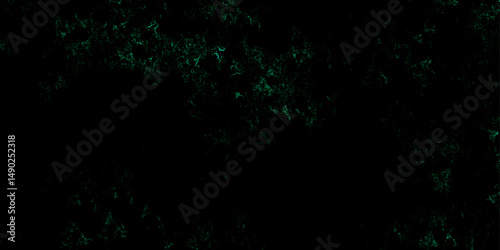 Dark green jade color toned distressed turquoise grunge texture on a dark background. Green painted cement wall texture with cracks. Abstract Black and Green Grunge background. 