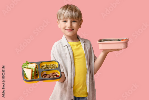 Little boy with lunchboxes ...
