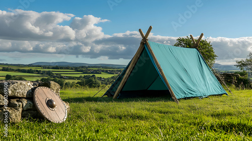 Viking era camping scene with tent and shield against a scenic backdrop