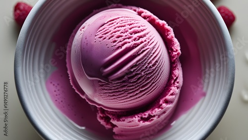 a scoop of vibrant raspberry ice cream