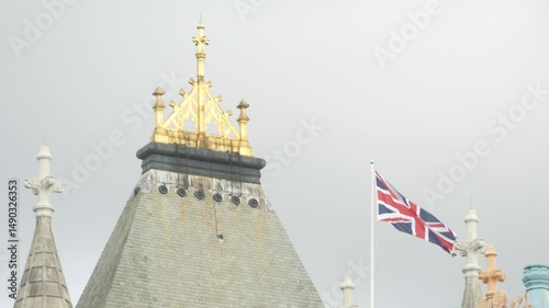 Close-Up Shot of Union Jack and Golden Roof Detail on Tower Bridge