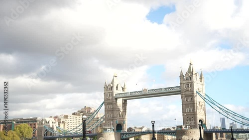 Tilt-Down Shot of Tower Bridge and Riverside Amphitheatre with People