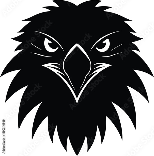 a front facing silhouette of an eagle's head with sharp eyes