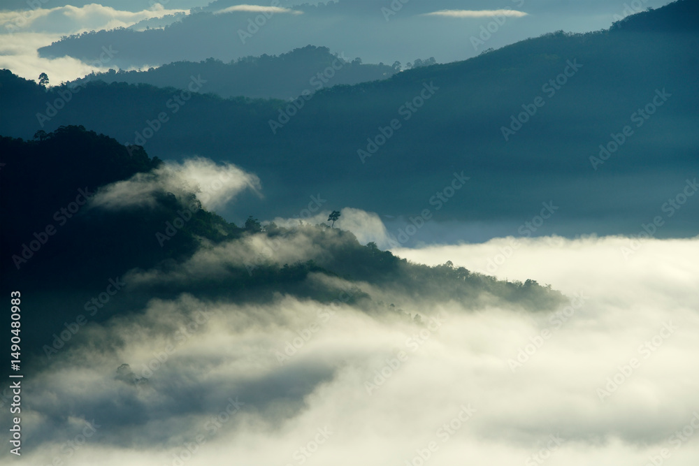 Obraz premium Serene Misty Mountains Under Soft Morning Light and Dramatic Sky