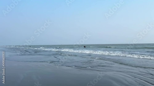 waves breaking on the beach