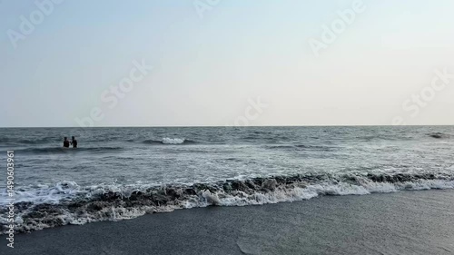 waves breaking on the beach