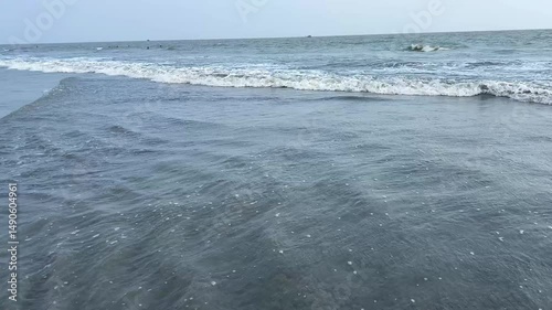 waves breaking on the beach