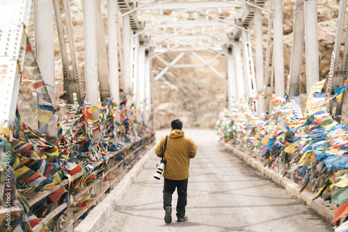 Wallpaper Mural Photographer exploring Leh Ladakh with professional camera gear, capturing breathtaking mountain landscapes and documenting adventure travel in Northern India Himalayan region Torontodigital.ca