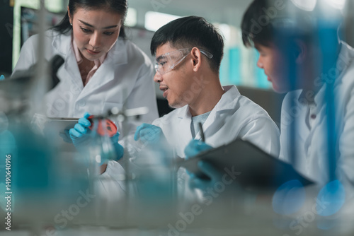 Researchers collaborate in a cutting-edge DNA laboratory, analyzing samples on petri dishes to explore genetic structures and decode molecular data for innovative scientific breakthroughs