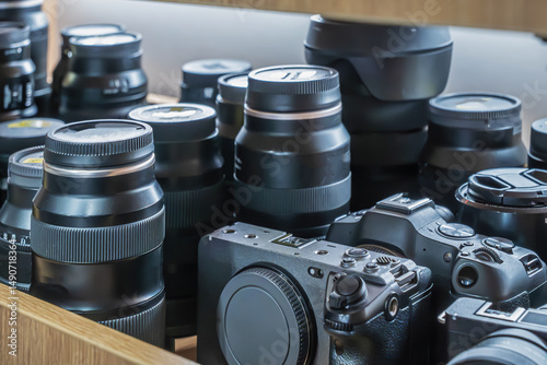 Lots of cameras on the shelf and Photo lenses for rent. Large selection of professional cameras and lenses available for rental at local photography shop
