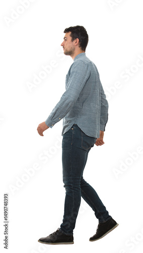 Full length side view portrait of a confident man walking isolated on transparent background