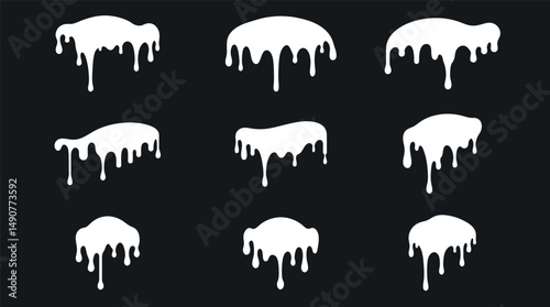 Abstract Paint Drips: An artistic display of white paint drips against a dark background, perfect for adding a touch of edgy style or a unique aesthetic to a design or project.