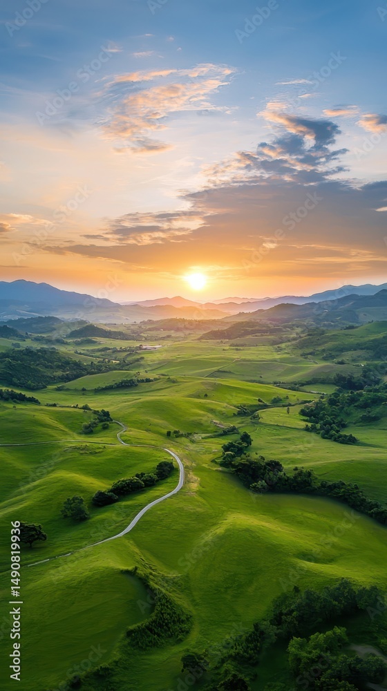 Fototapeta premium Sunset over rolling green hills serene landscape nature photography tranquil environment aerial view scenic beauty