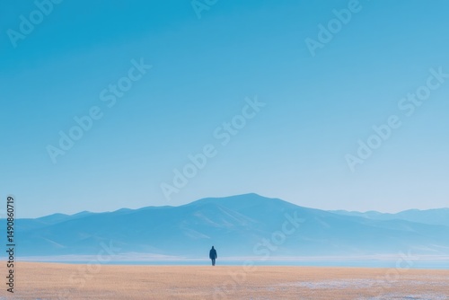 serene wide-open landscape showcases lone figure embarking on peaceful walk framed by vast sky