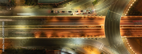 Quadro em tela Expressway top view, Road traffic an important infrastructure, Urban cityscape c